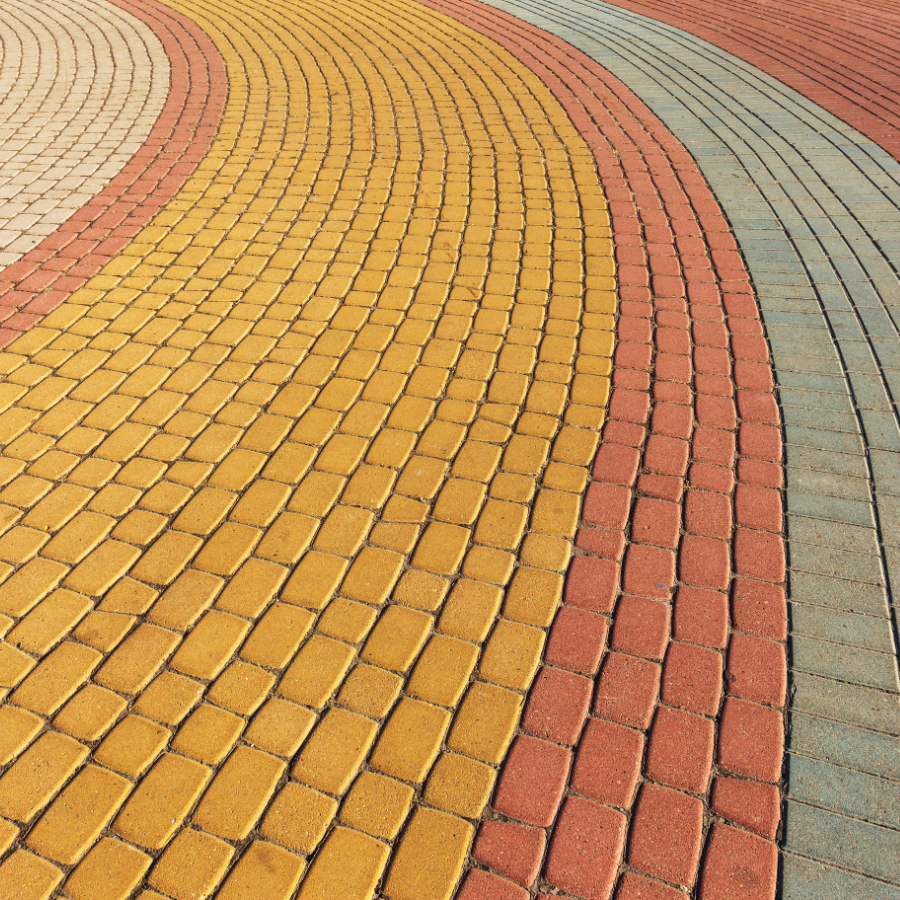 curved paths of different colored bricks next to each other